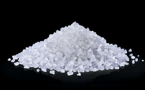 Fototapeta heap of salt isolated on black background.