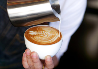 close up barista hand making a cup of coffee.