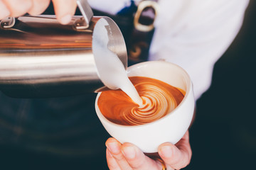close up barista hand making a cup of coffee.