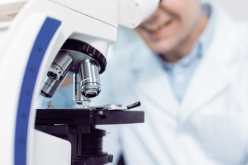 Optical lenses. Selective focus of details of a modern professional microscope being used for biological research