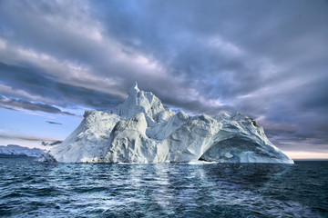iceberg floating in greenland fjord