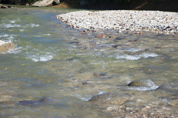 mountain stream flowing from the glacier