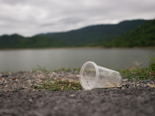 Fototapeta na wymiar Plastic glasses were left by tourists
