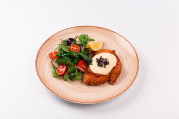 Top and front view isolated - Chicken parmesan cheese and mixed salad.