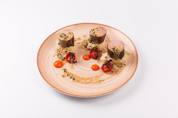 Top and Front View isolated - Pork mushout with crushed potatoes and horseradish cheese and green pepper sauce.