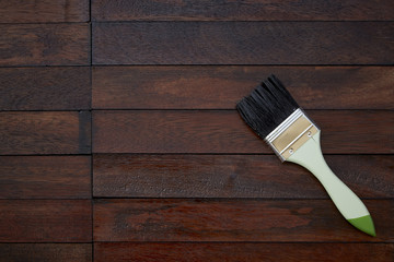 Paintbrush on a wooden background