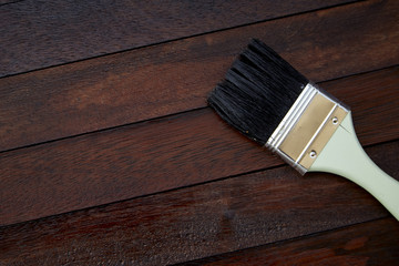 Paintbrush on a wooden background