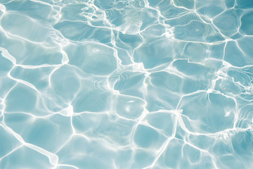 Texture of water in swimming pool for background