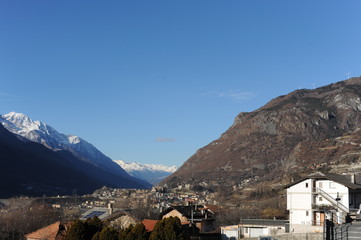 Panoramic view of Aosta valley (Valle d’Aosta) from Saint-Vincent in winter with Italian Alps in...
