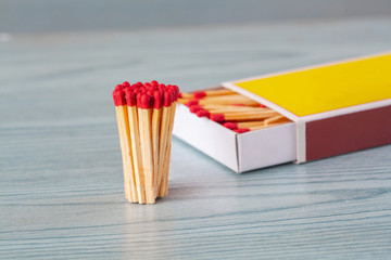 Matchstick on color wood table.