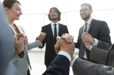 Fototapeta premium business team holding each other's hands