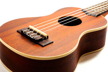 Fototapeta premium ukulele, brown on a white background.