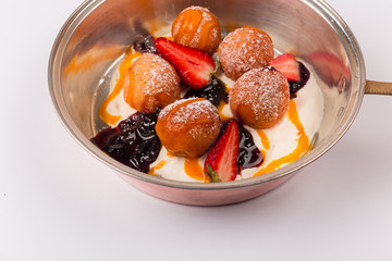 Front and top view isolated Dessert - Cheese pancakes with sour cream and cranberry juice and strawberry puree.