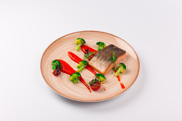 Top and Front View Isolated - Salmon with baked peppers, broccoli, lemon