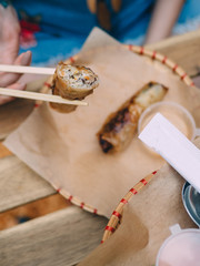 Vietnamese cuisine Nem Ran spring roll on plate with chopsticks in hand