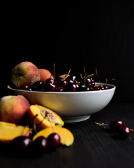 Cherries and peaches in a bowl