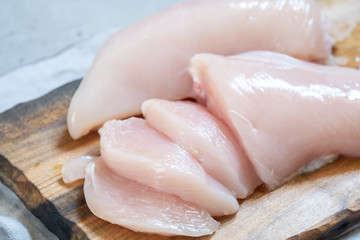 Fresh chicken meat on wooden board