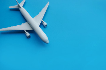 Copyspace of white airplane on blue background