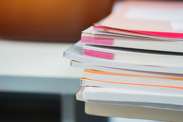 Business offices busy concept. Unfinished documents stacks of paper files on office desk for report papers, piles of unfinish sheet achieves at workplace indoor