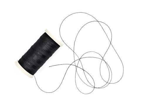 Spool of sewing thread isolated on white background.