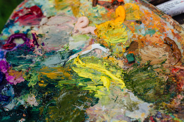 Obraz na płótnie Canvas Close up palette with oil paints.