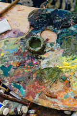 Obraz na płótnie Canvas Close up palette with oil paints.
