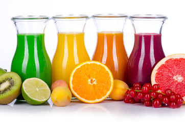 fruit smoothies in different colours with fruits