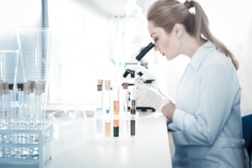 Biological samples. Selective focus of test tubes standing on the table while being used for the...