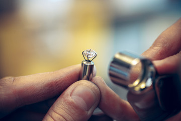 Different goldsmiths tools on the jewelry workplace. Jeweler at work in jewelry.