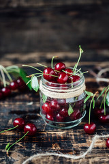 Fresh ripe cherries on a wooden table. Wooden background