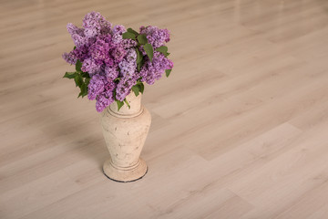 vase with a bouquet of lilacs close-up
