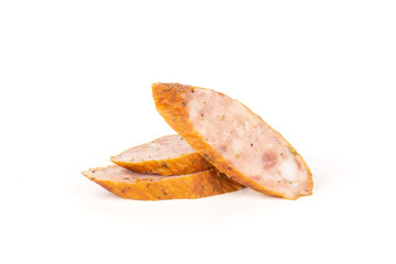 Group of three slices of dry smoked ham sausage isolated on white