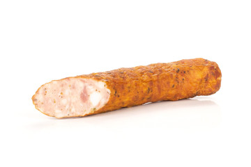One half of dry smoked ham sausage isolated on white