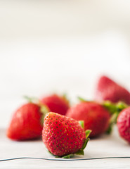 Fresh strawberries close up on wooden background