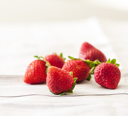 Fresh strawberries close up on wooden background