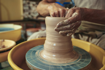 Creating a jar or vase of white clay close-up. Master crock.