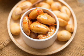 Peeled zalacca fruit in sweet and spicy sauce