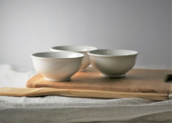 Fototapeta na wymiar china tea cups on bamboo cutting board 