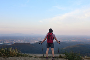 a female hiker who has reached the top