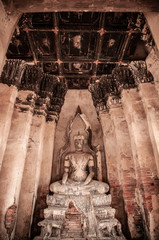 Ruined Buddha sculpture of Wat Chai Watthanaram, Ayutthaya, Thailand