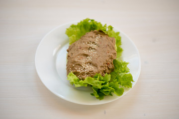 photo of a natural meal on a light background on a white plate.