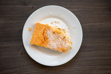 photo of a real meal on a dark background on a white plate.