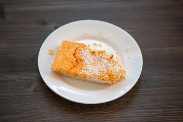 photo of a real meal on a dark background on a white plate.