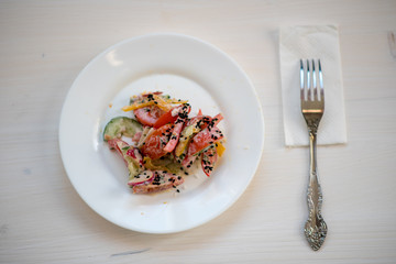 photo of a natural meal on a light background on a white plate.