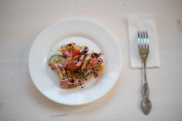 photo of a natural meal on a light background on a white plate.