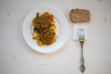 photo of a natural meal on a light background on a white plate.