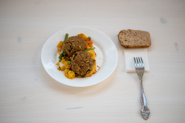 photo of a natural meal on a light background on a white plate.