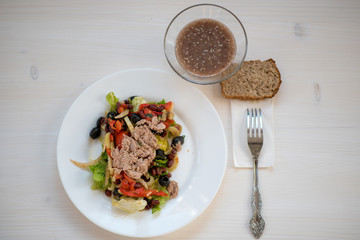 photo of a natural meal on a light background on a white plate.