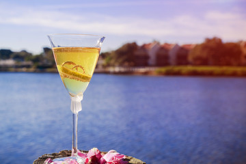 Beautiful high heel wedding rings and glasses on beach wedding concept