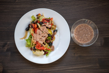 photo of a real meal on a dark background on a white plate.